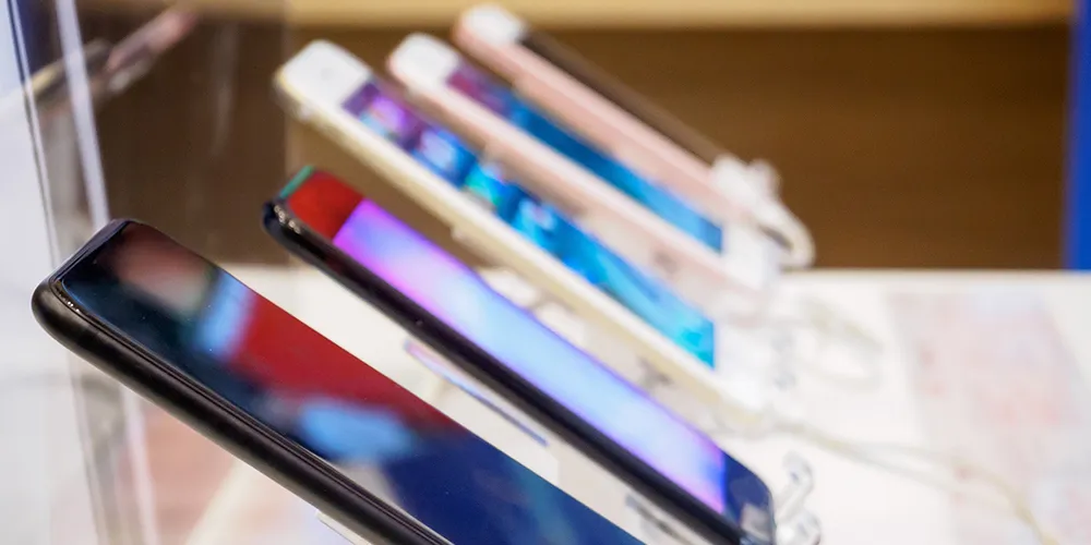 Several mobile phones on a stand