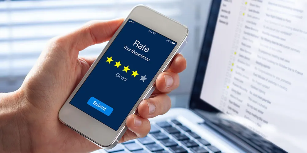 social-wifi-reviews Person rating their experience on a mobile phone