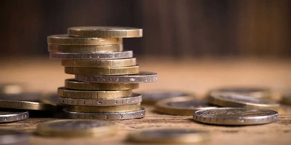 energy-save-big Several coins stacked on a table