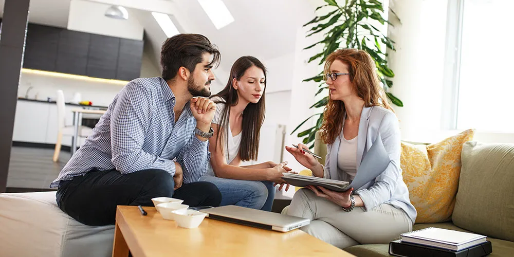 customer-partnerships Business women discussing details with two customers